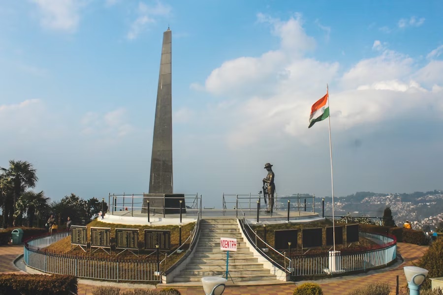 The Gorkha war memorial and obelisk at Batasia Loop, Darjeeling, with the Indian flag flying